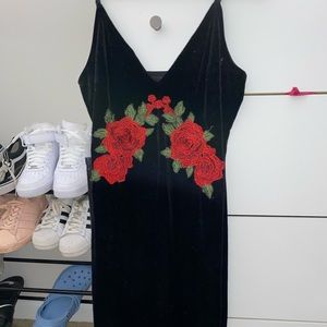 Black velvet dress with red flower detailing